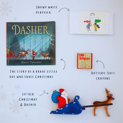 Children's book 'Dasher' by Matt Tavares, Santa Claus figurine, deer figurine, and crayons on a white background.